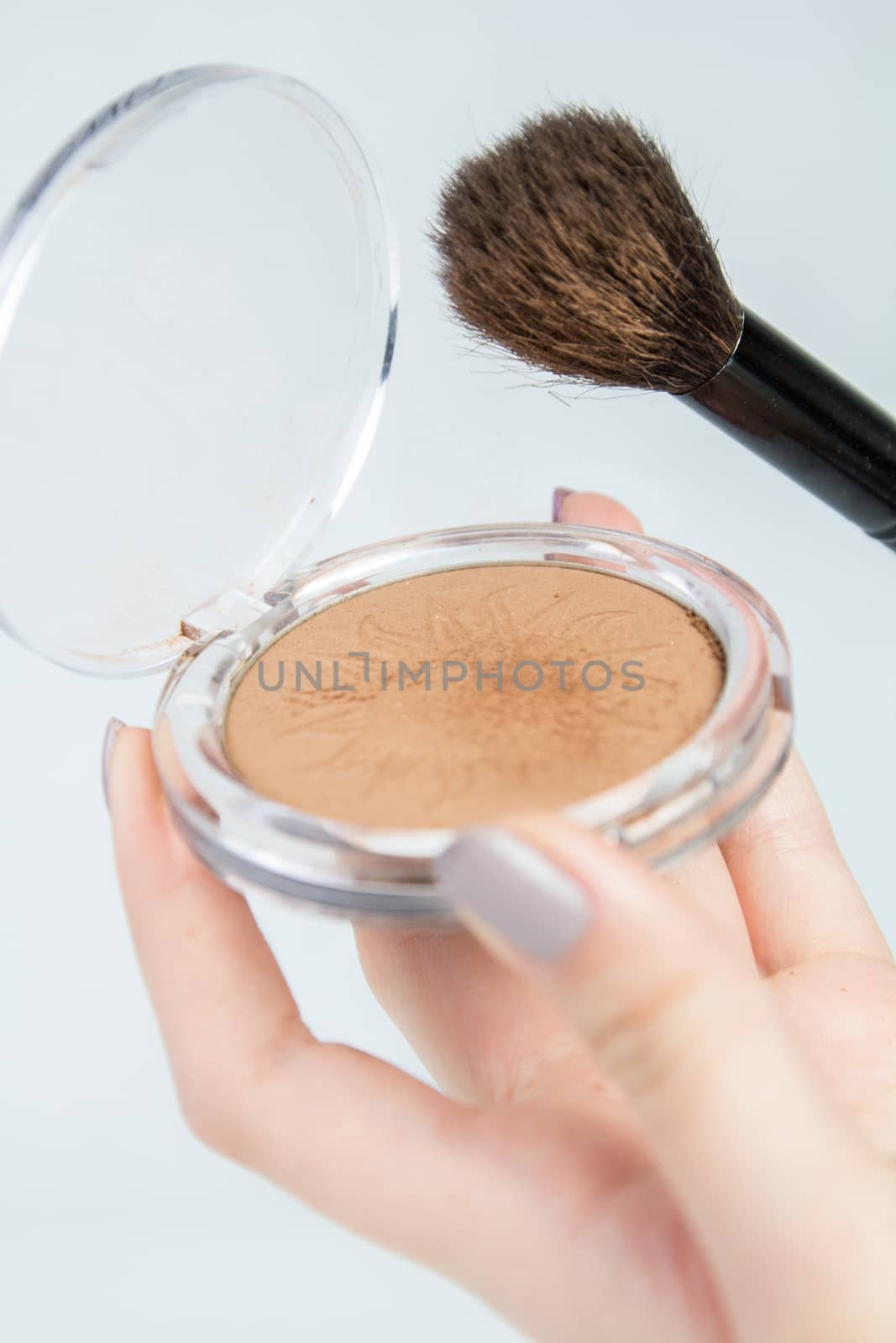 Bronzer in use with make up brush