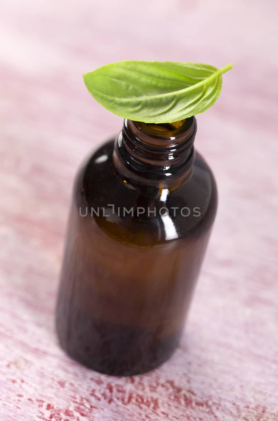 Aromatherapy - Basil essential oil bottle  by JPC-PROD