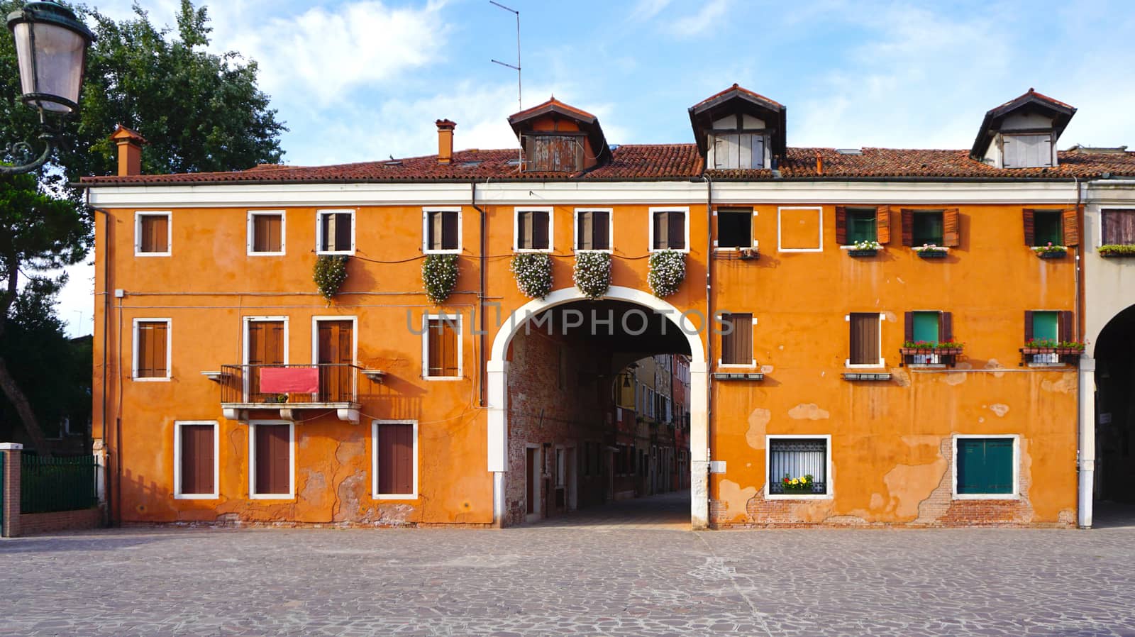 orange color old charming building in Venice, Italy