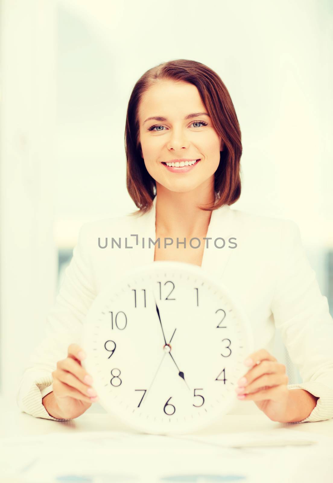 attractive businesswoman with white clock by dolgachov