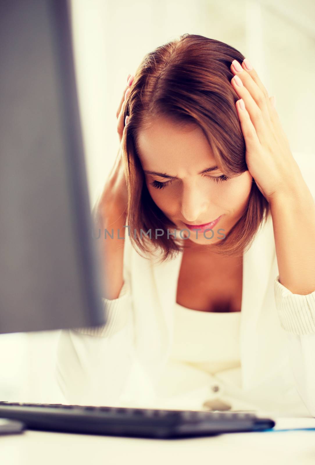 stressed woman with computer by dolgachov