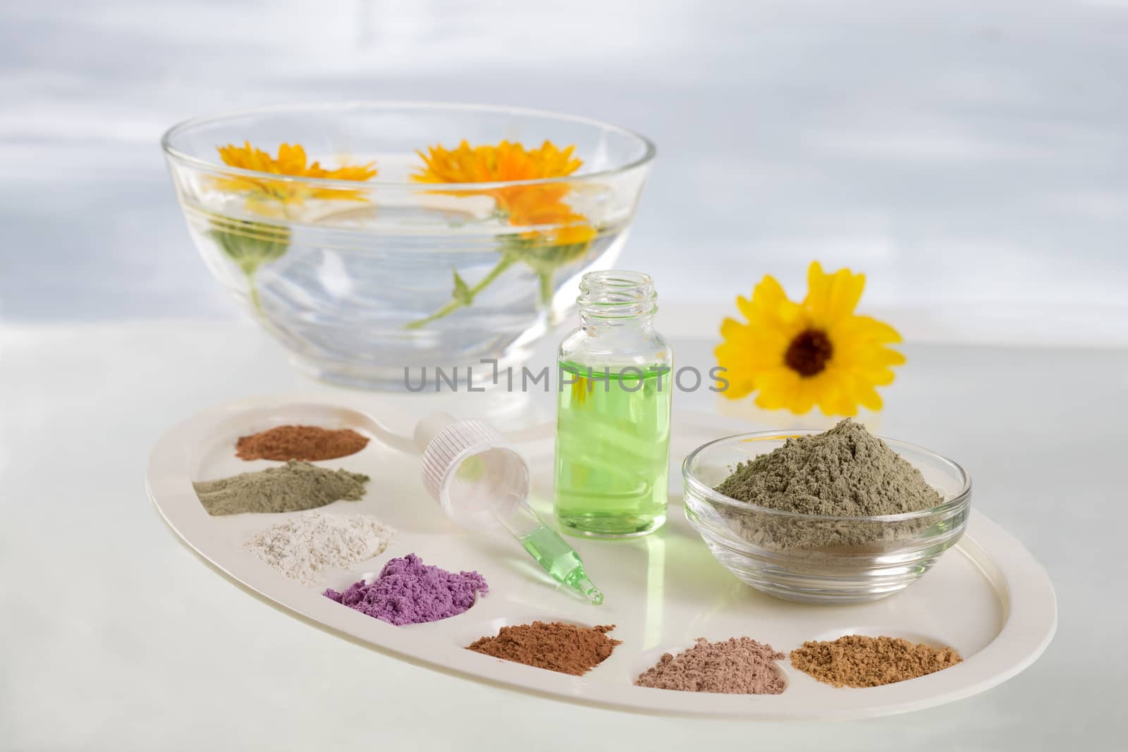 Body care and spa treatment concept, range of coloured french clay and essential oil for mud therapy