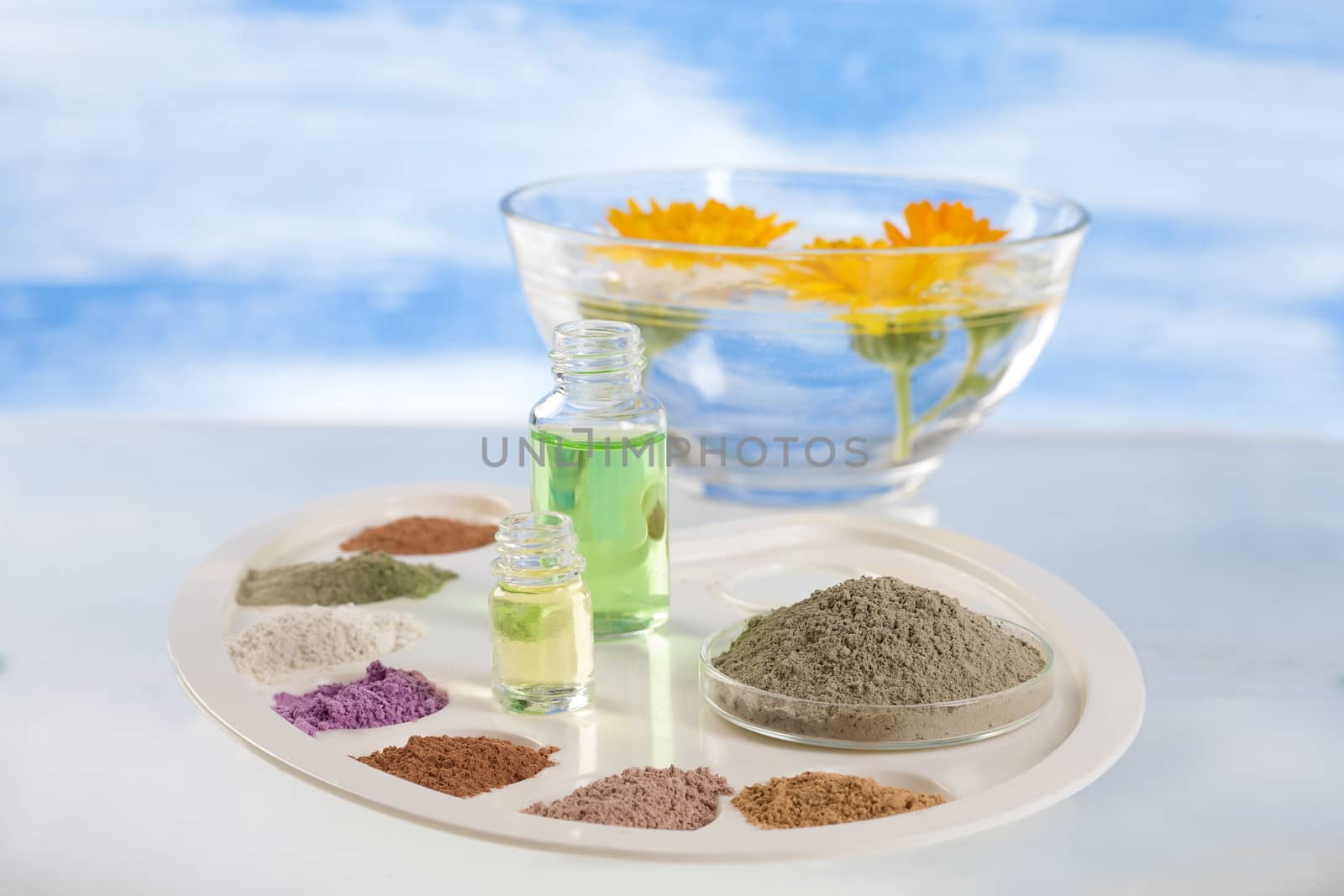 Body care and spa treatment concept, range of coloured french clay and essential oil for mud therapy