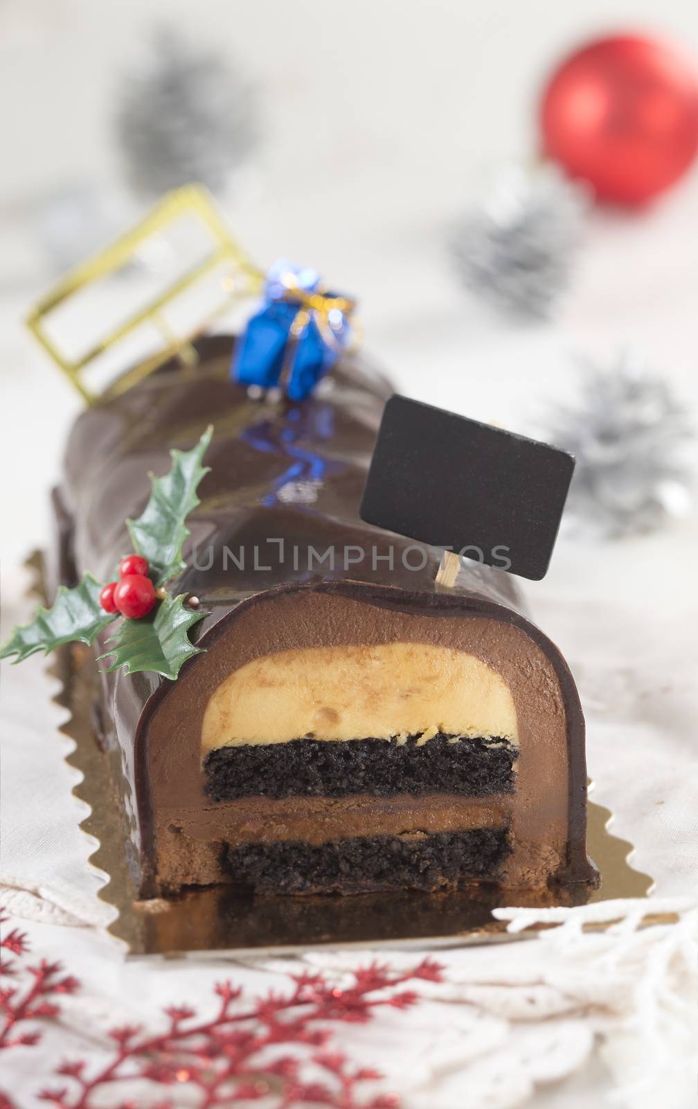 Christmas chocolate yule log cake with decoration