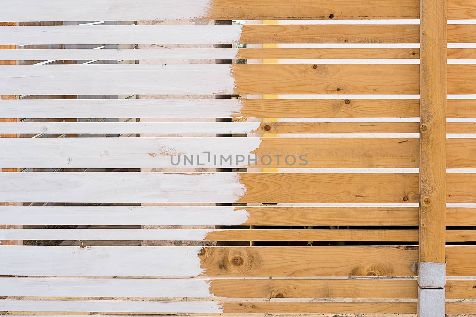 old wooden fence that is painted white
