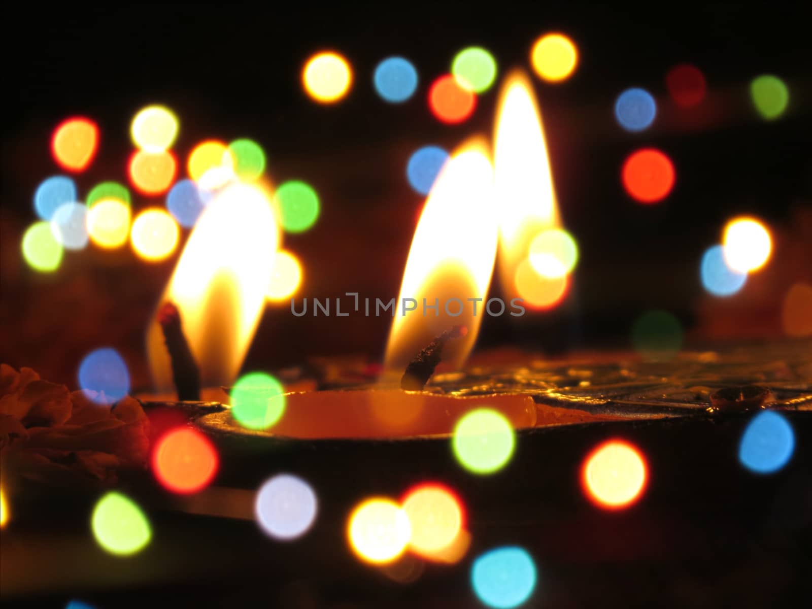 An abstract view of traditional Diwali lamps in colorful blur festive lights during Diwali festival in India.