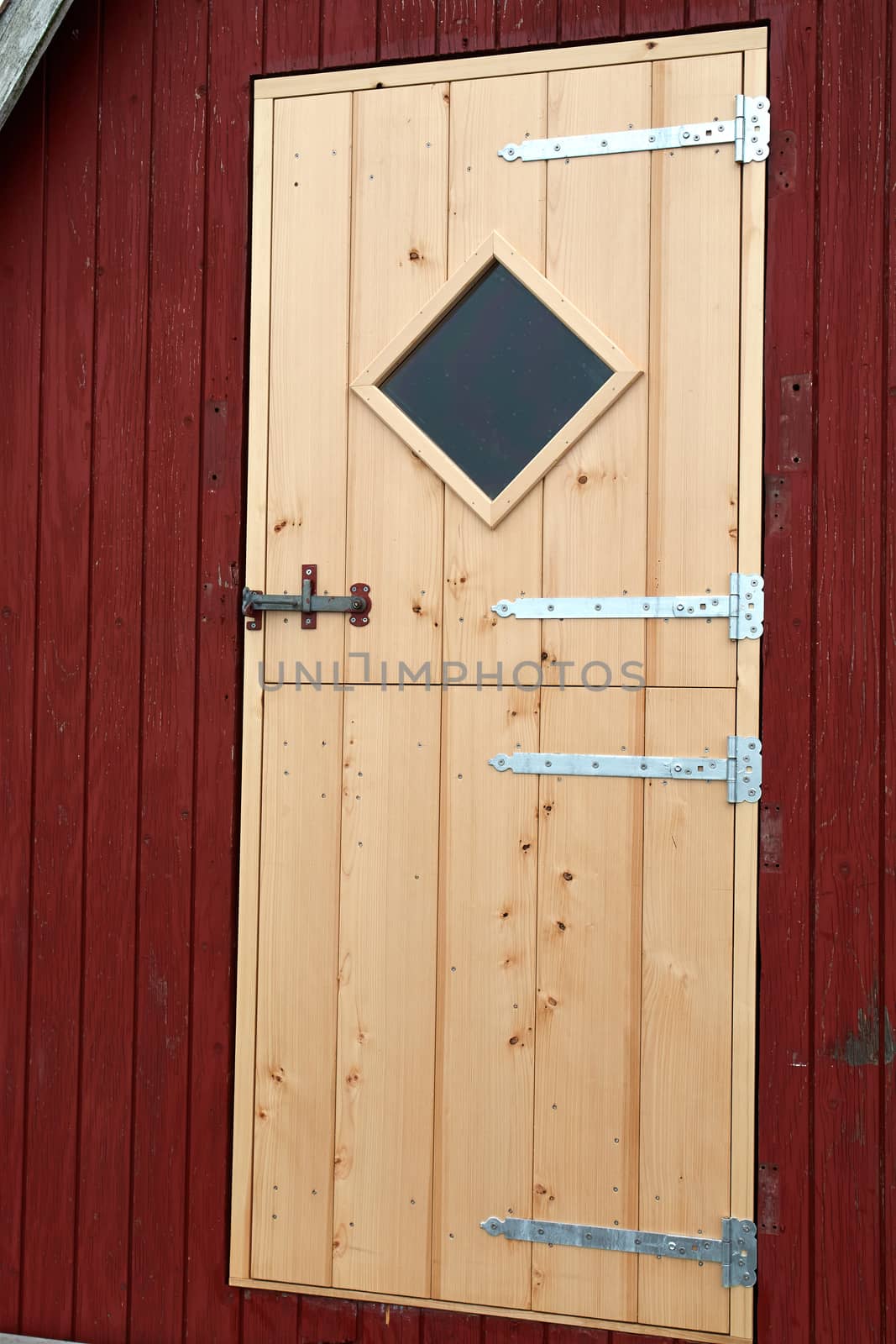 Details of beautiful red fishing huts on the coast Faaborg Denmark                              