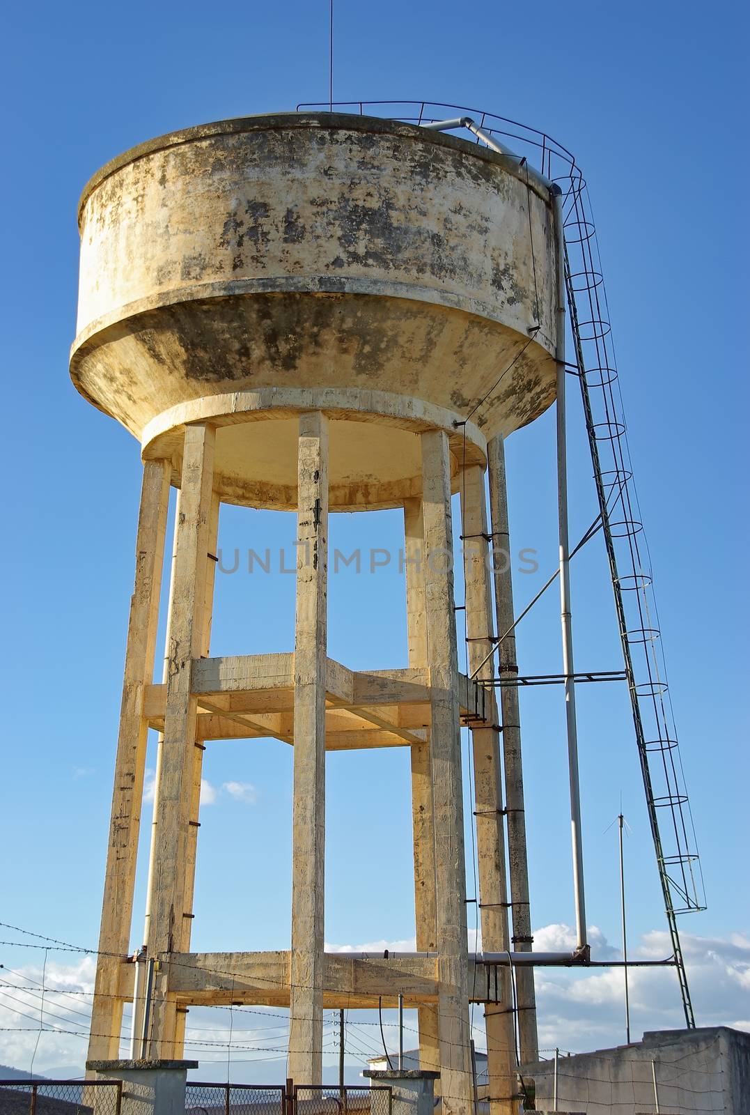 Big emergency water tank elevated over a mortar structure