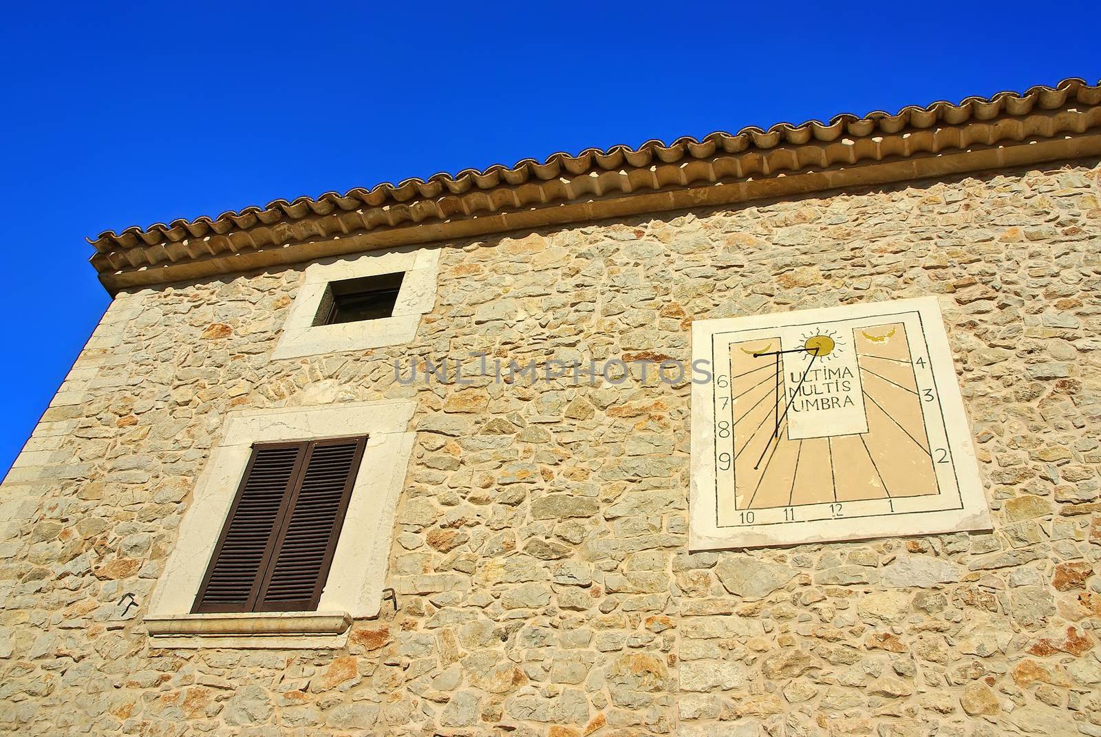 Mediterranean rural House in Majorca (Spain) with a solar clock on the facade