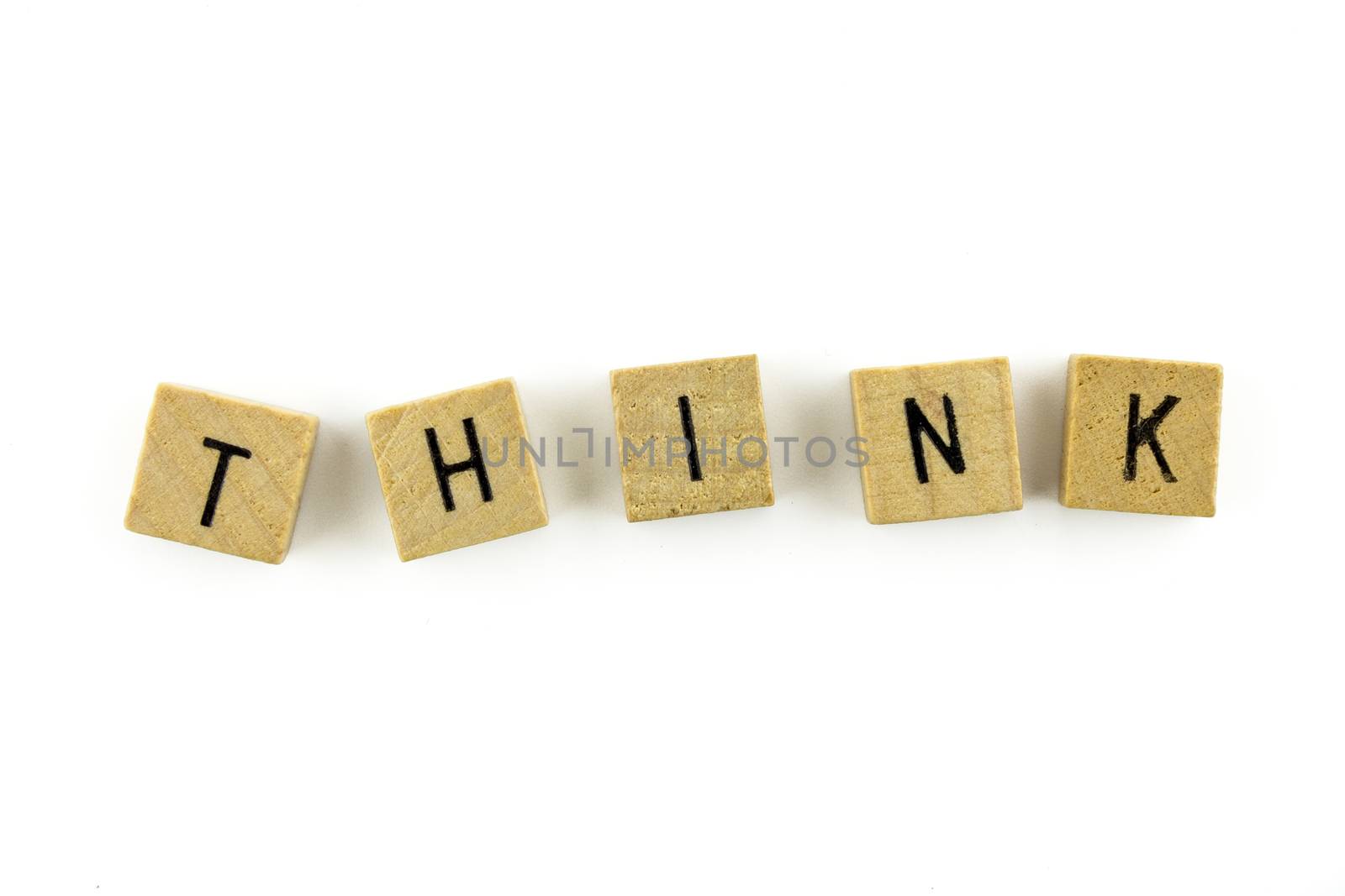 THINK word wooden alphabet blocks on white background from top view