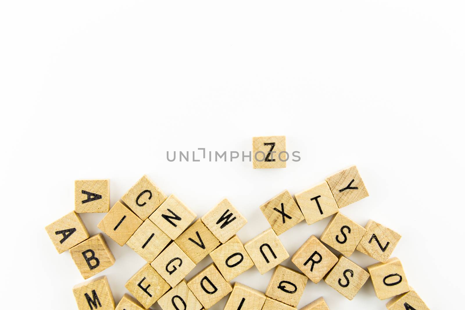 Wooden alphabet blocks use as background isolated