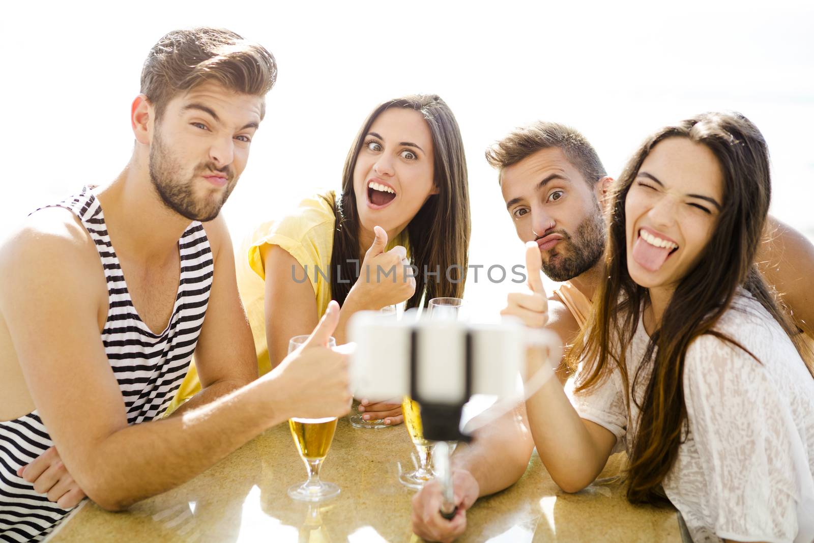 Group selfie at the beach bar by Iko