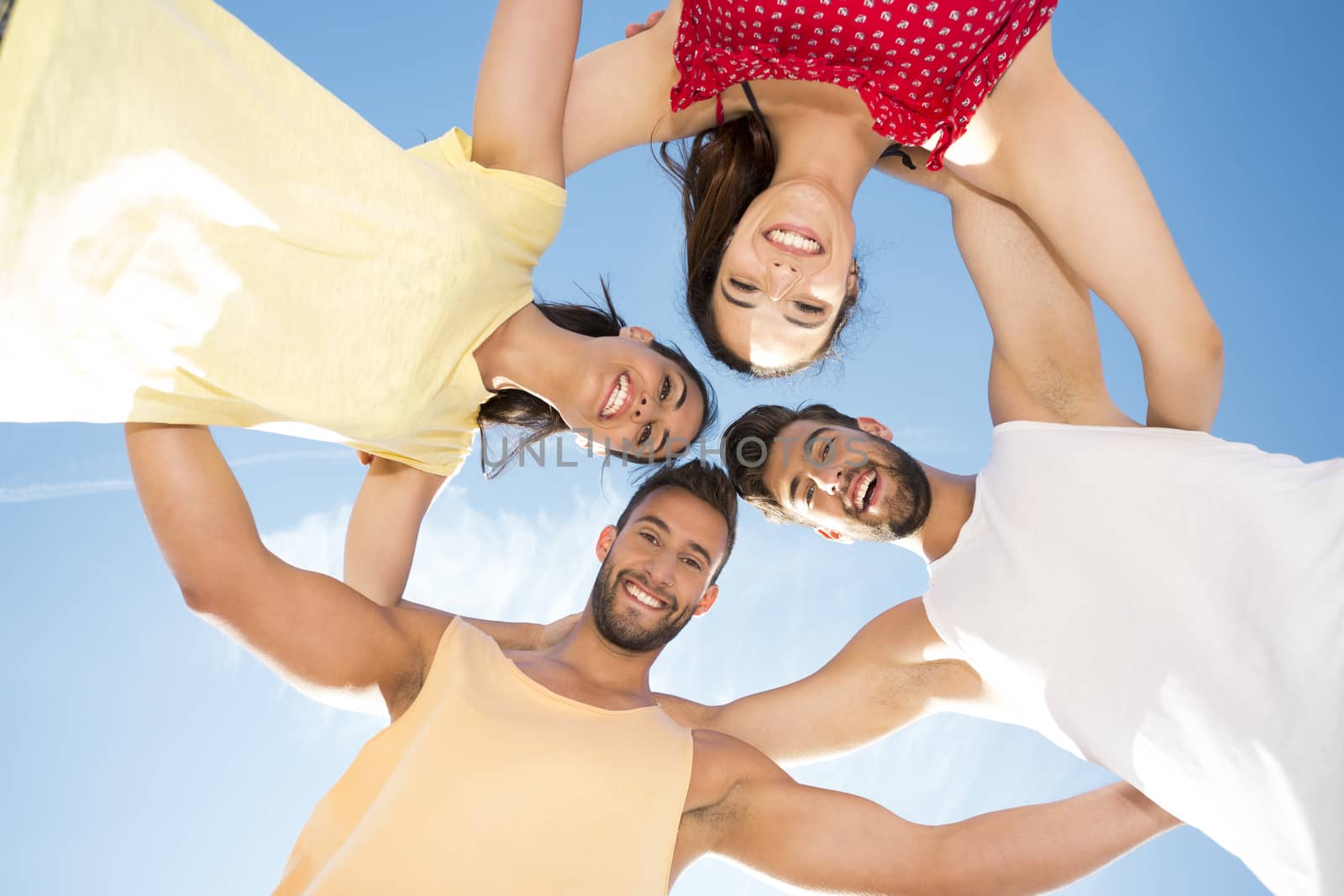 Group of friends having fun at the beach