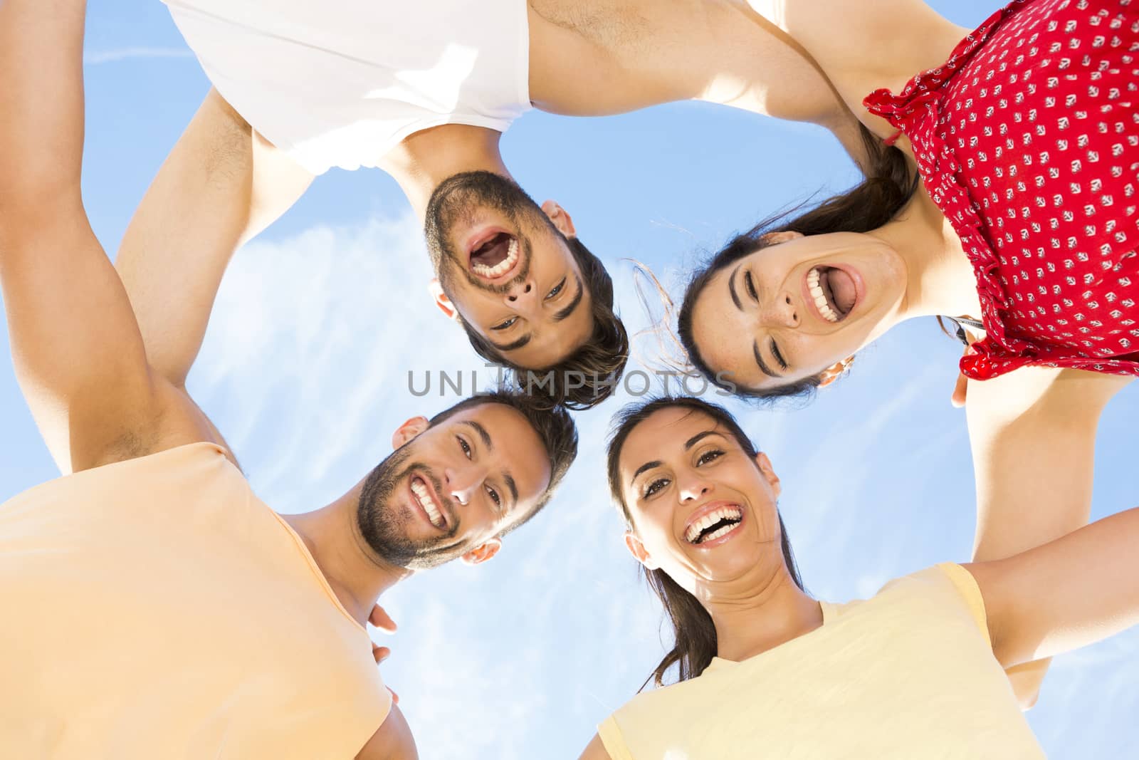 Group of friends having fun at the beach