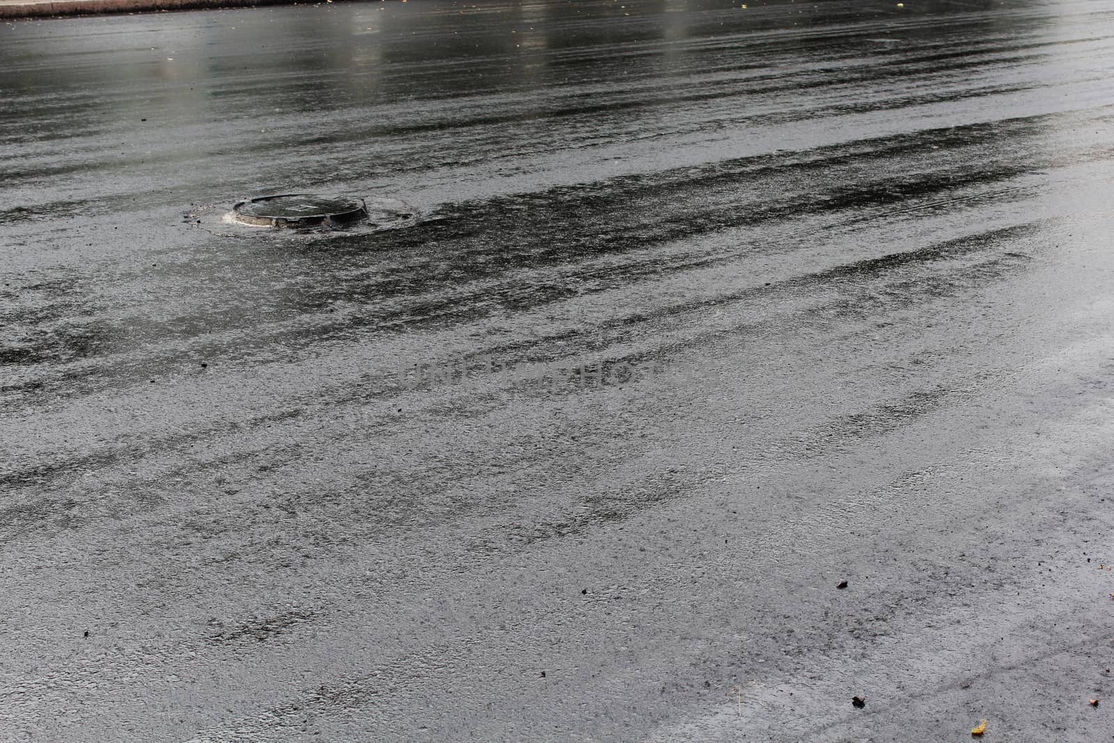 Freshly laid black tar asphalt pavement - a new road surface made of bitumen.