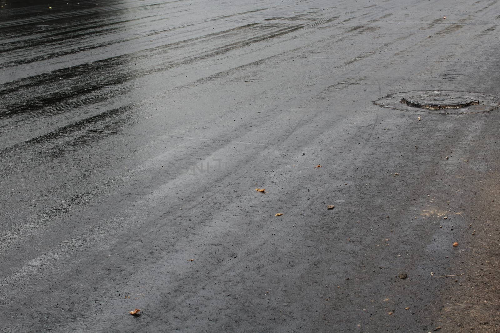 Freshly laid black tar asphalt pavement - a new road surface made of bitumen.