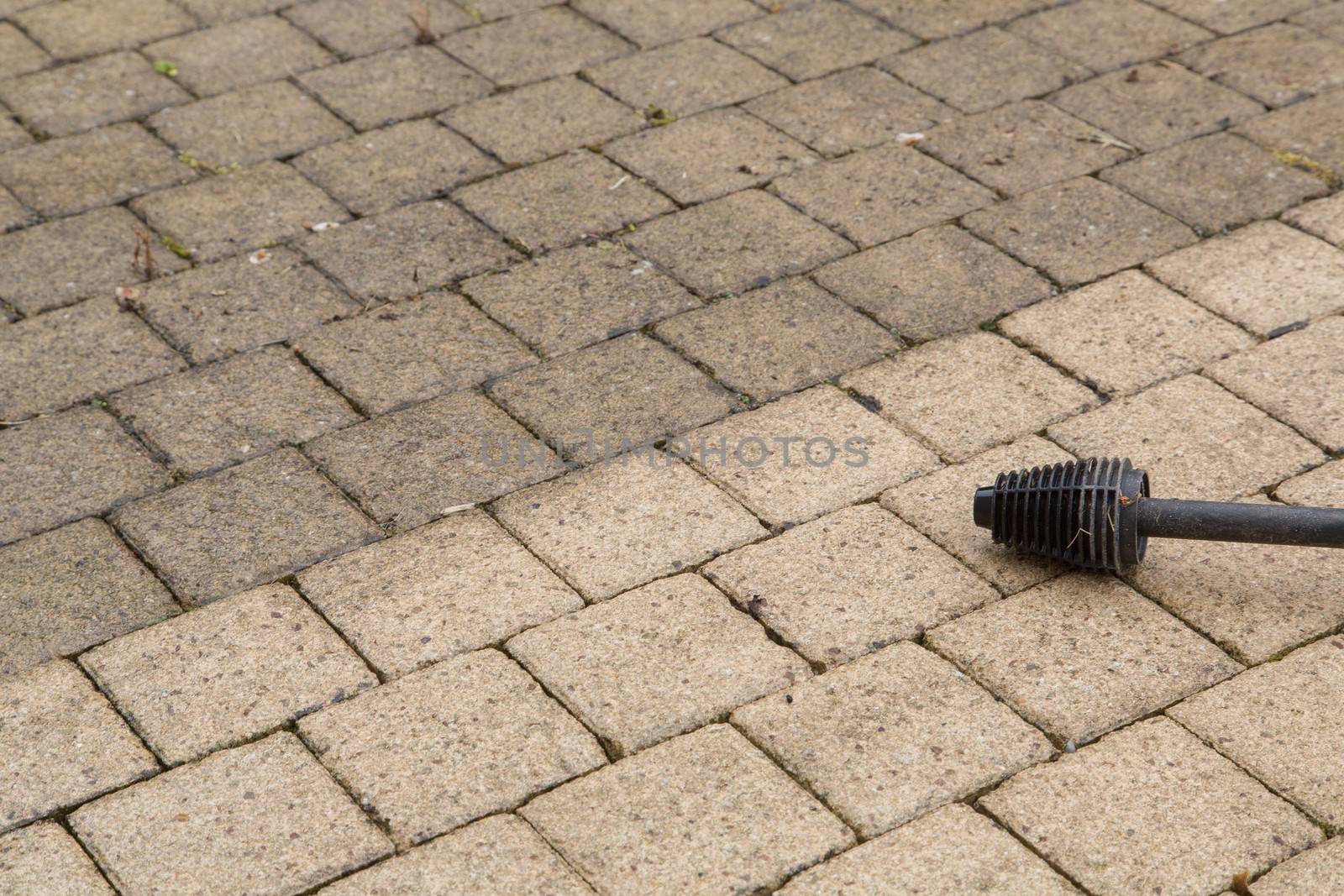 Outdoor floor cleaning with high pressure water jet
