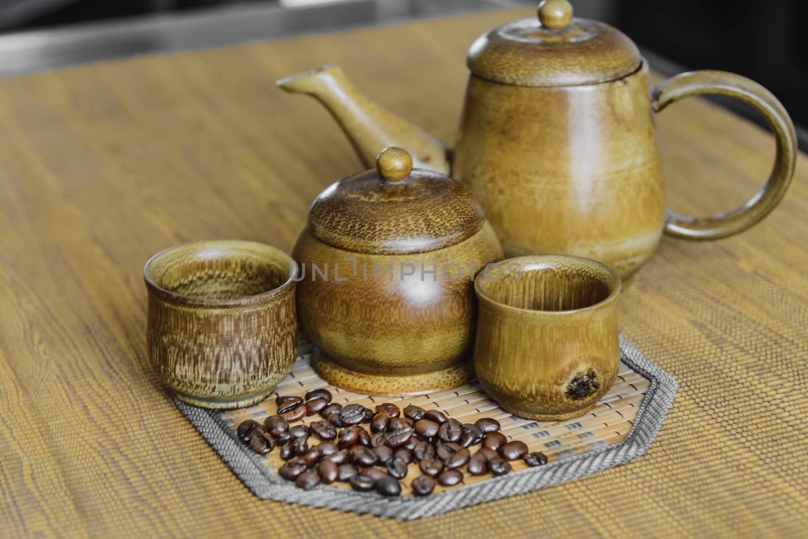 Soft focus image of coffee beans and coffee cups set on wooden background.Vintage style.(soft focus)