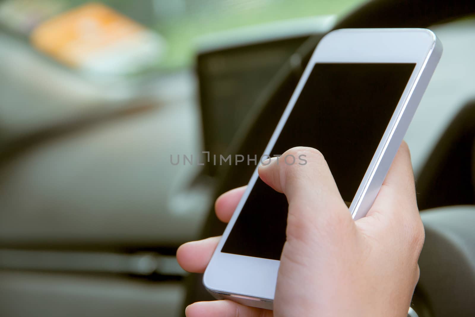 Woman Sitting in the Car and Using Smart Phone
