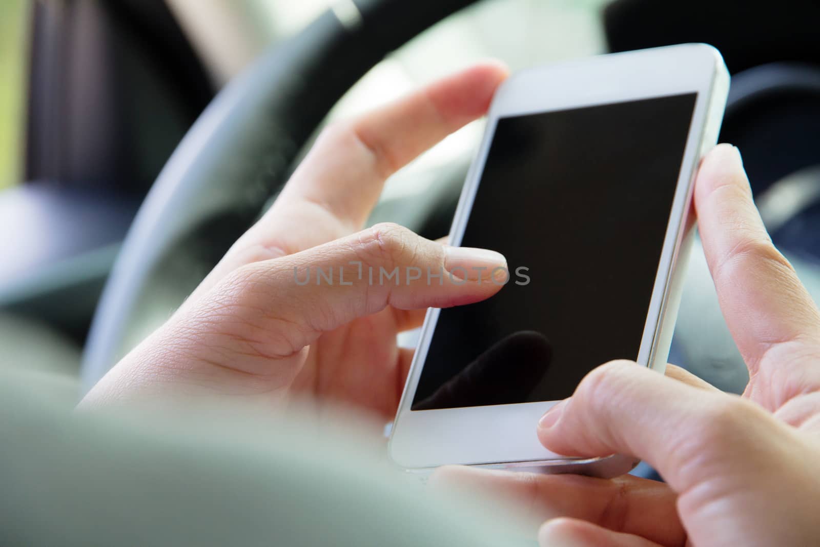 Woman Sitting in the Car and Using Smart Phone