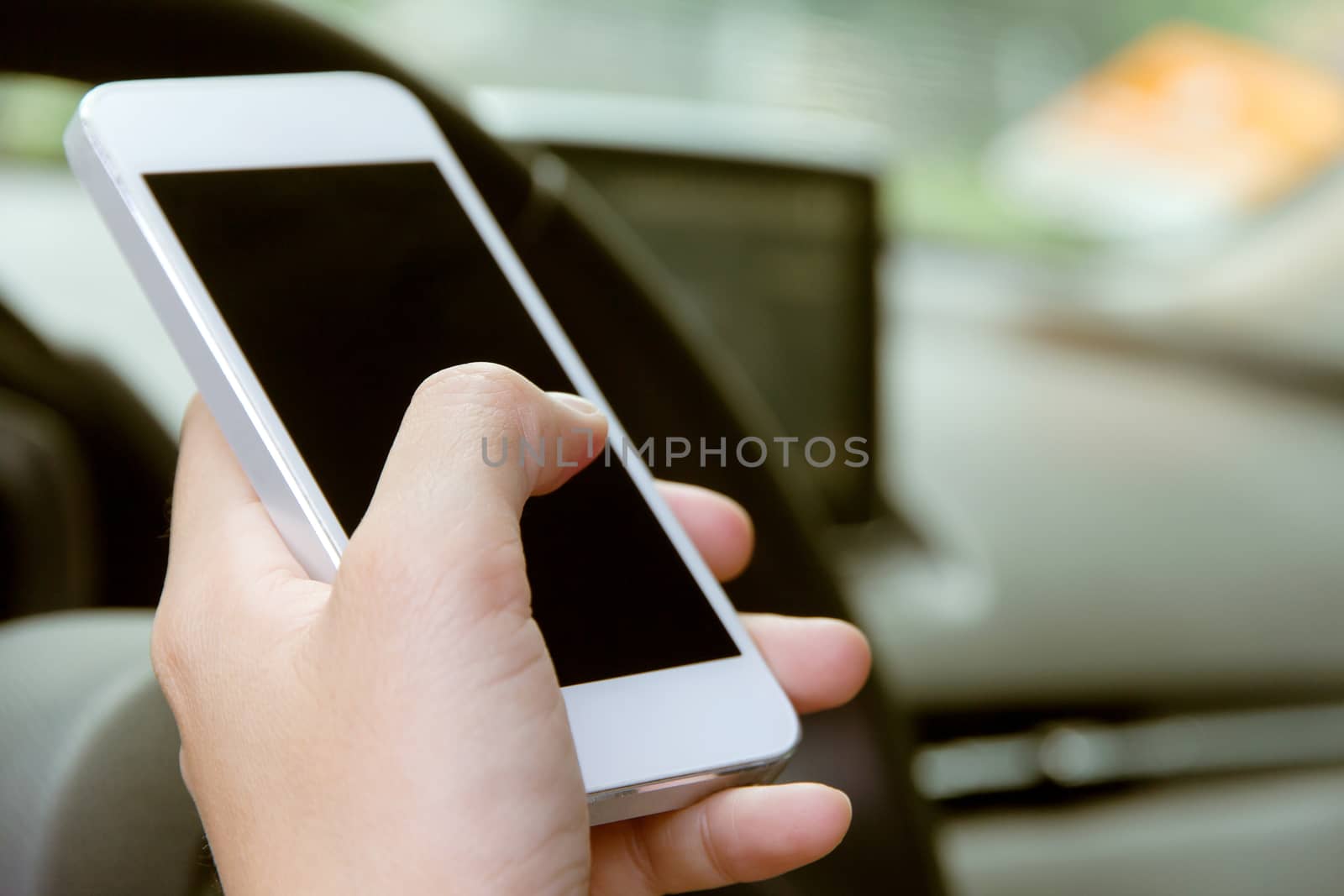 Woman Sitting in the Car and Using Smart Phone