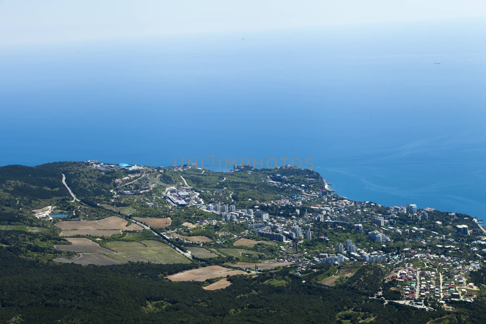 The seashore in the light of the sun from big height