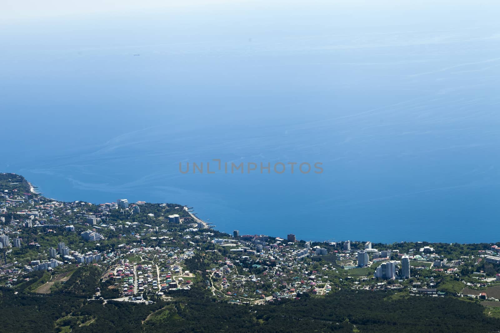 The seashore in the light of the sun from big height