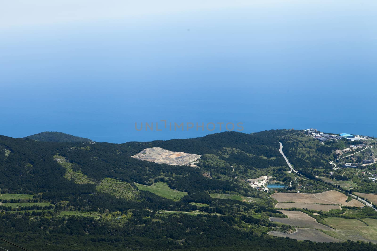 The seashore in the light of the sun from big height