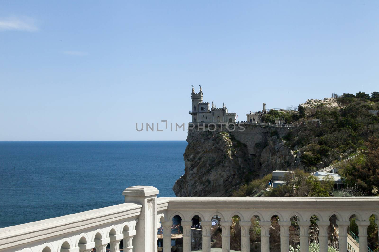 The castle by the sea is on the rock highly above water