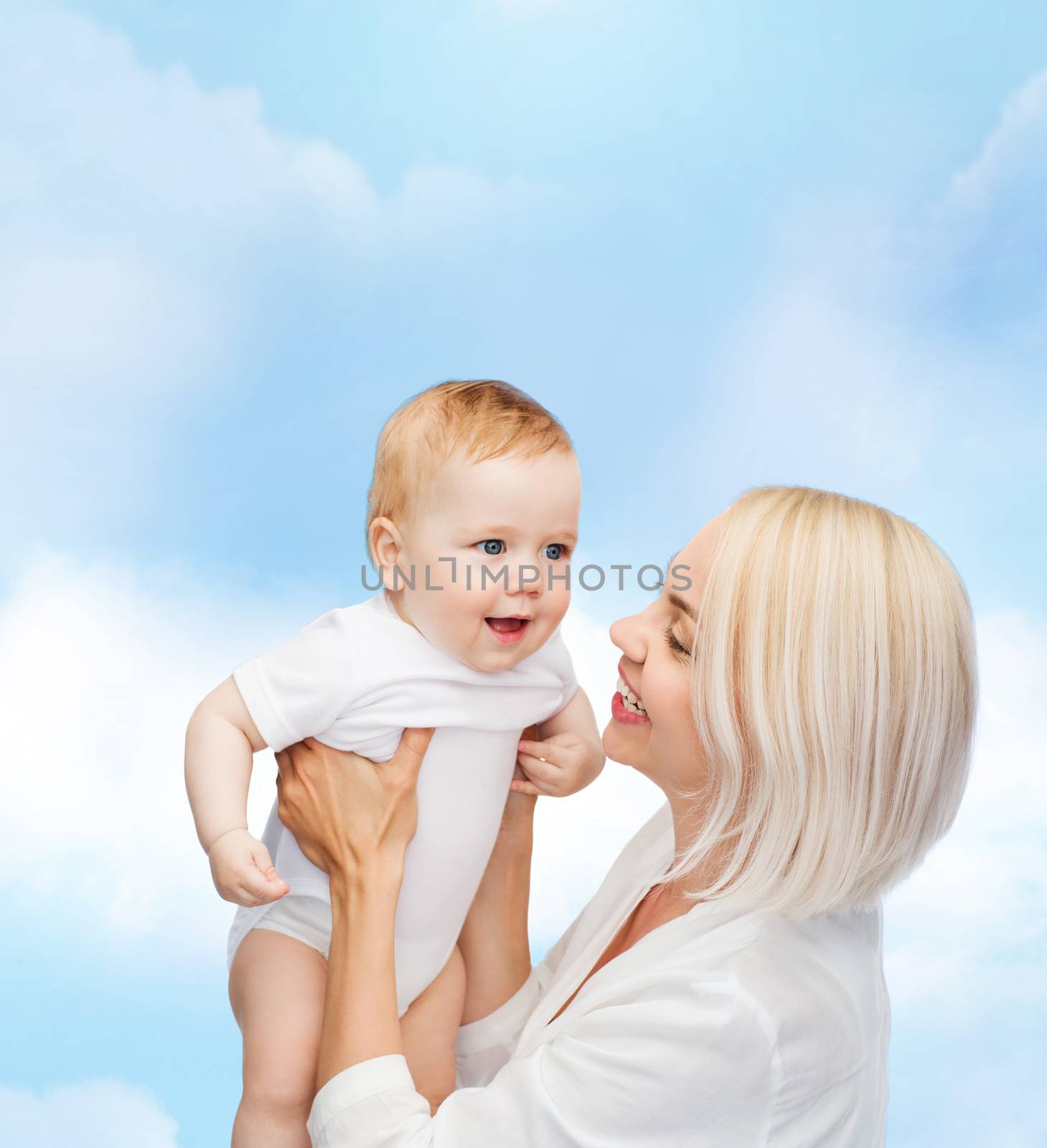 family, child and parenthood concept - happy mother with smiling baby