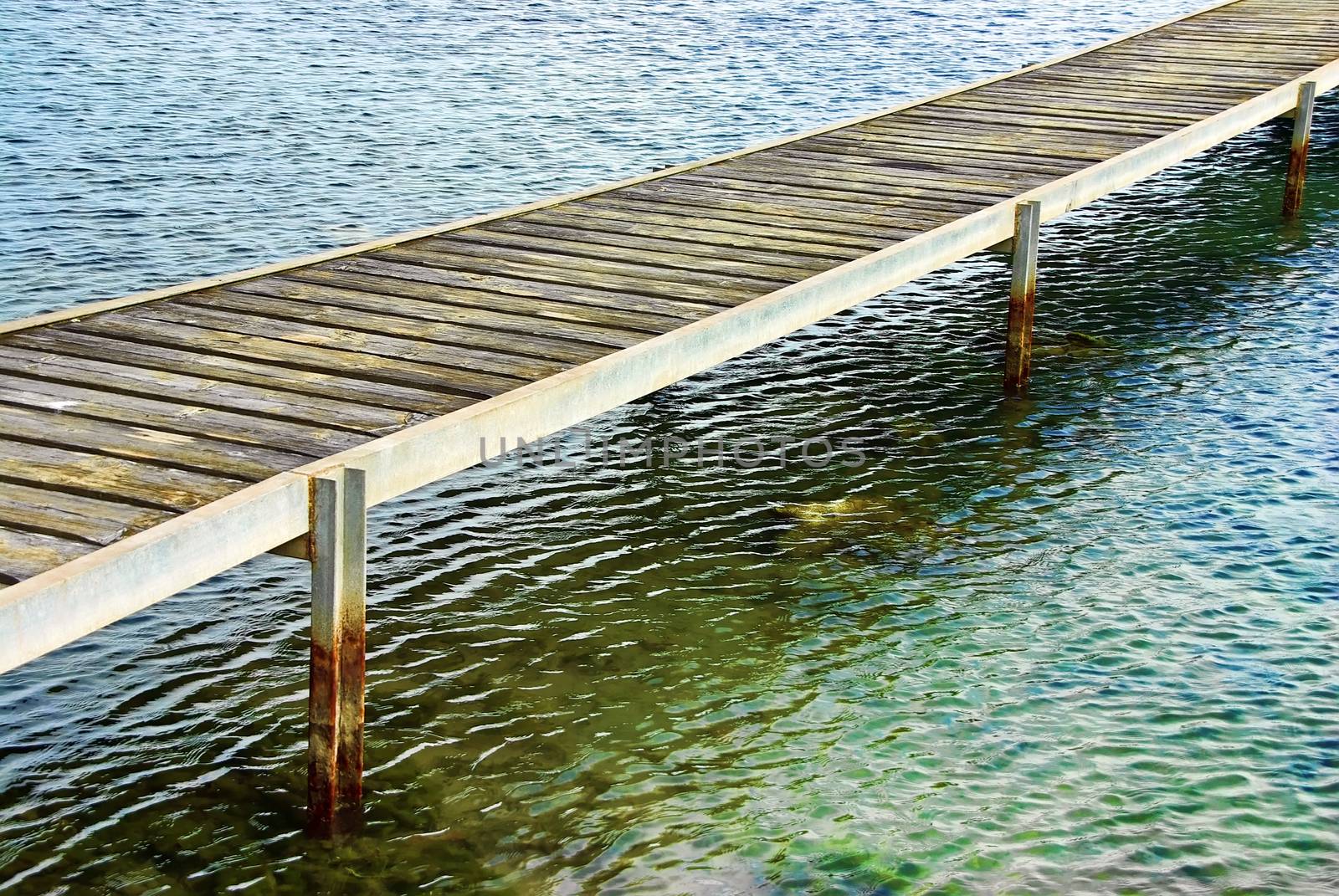 wooden catwalk ower the sea water