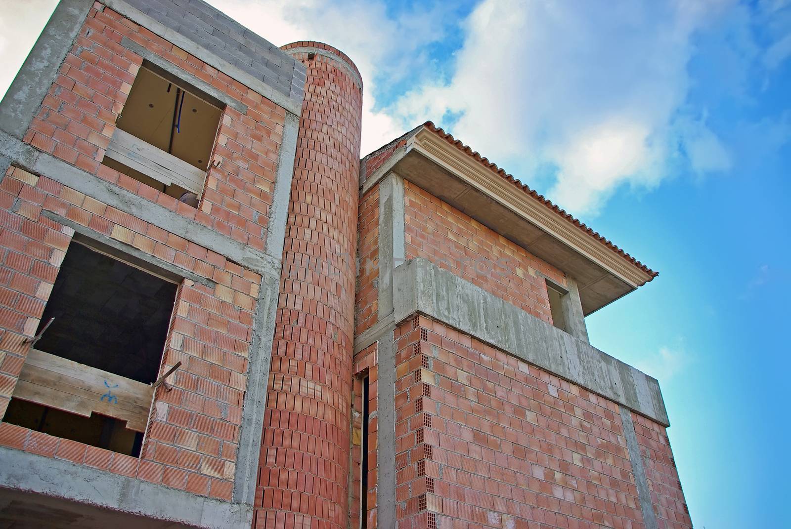 building of a new house with red brick walls