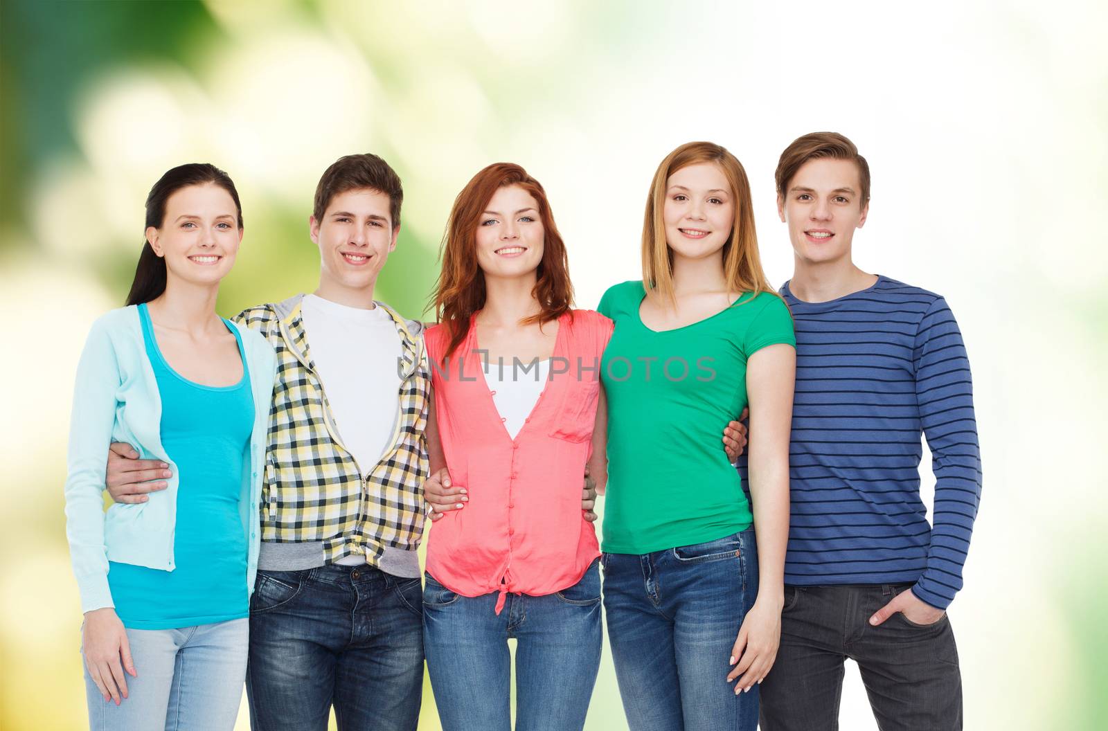 education and people concept - group of smiling students standing