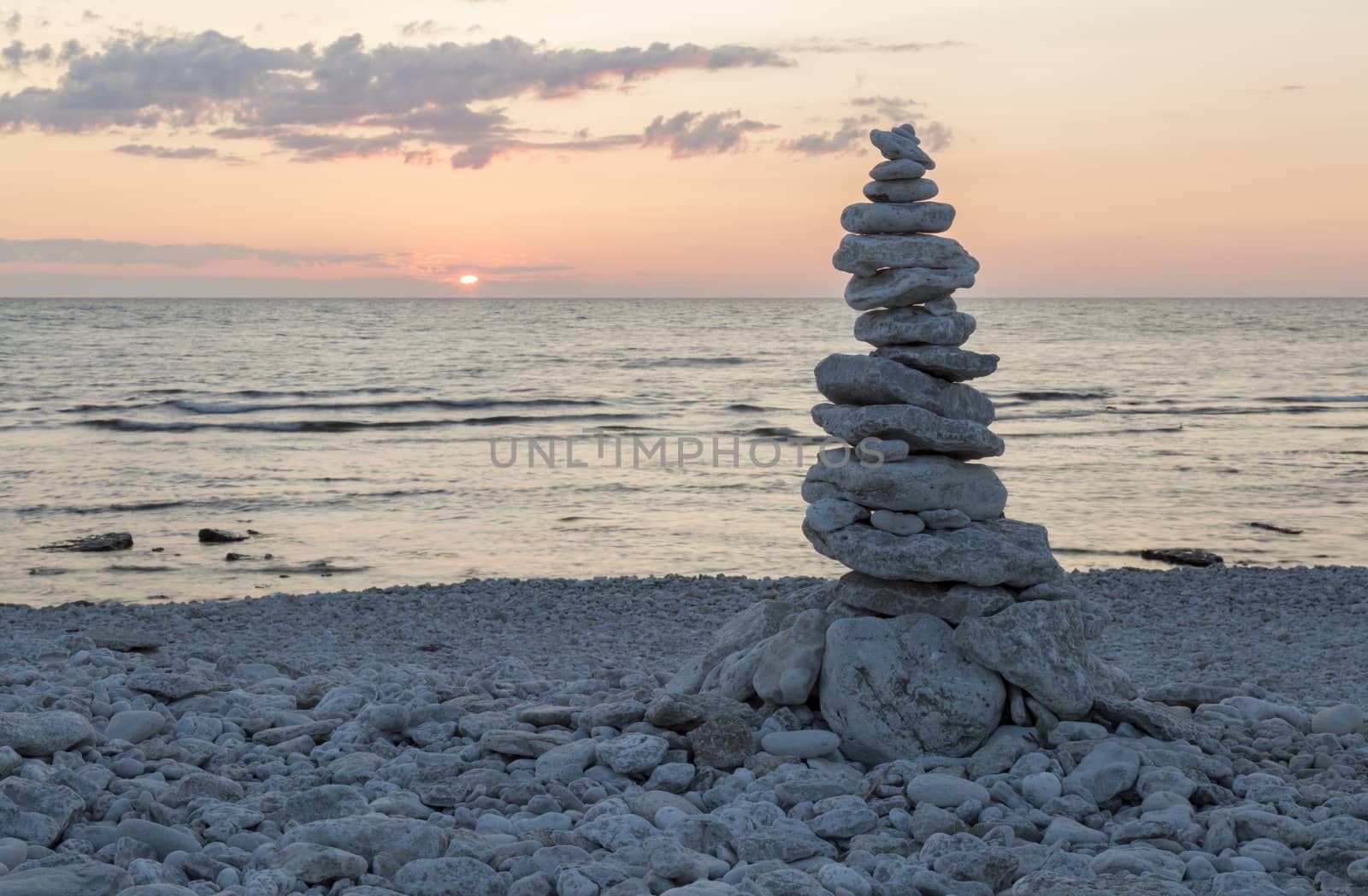 Rocks Piled on Each Other by ocean at sunset.