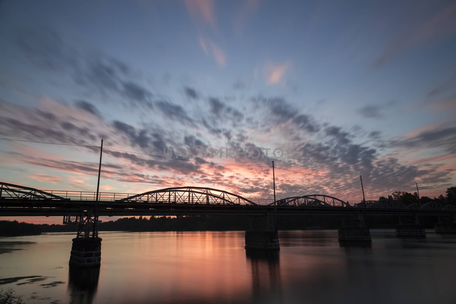Bridge over the Umeå, River in Sweden at sunset. This is the "Old Bridge" (Gamla Bron).
