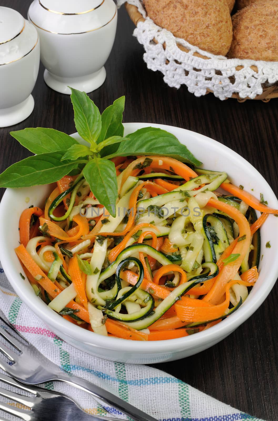 Salad with strips of carrot and zucchini pesto sauce