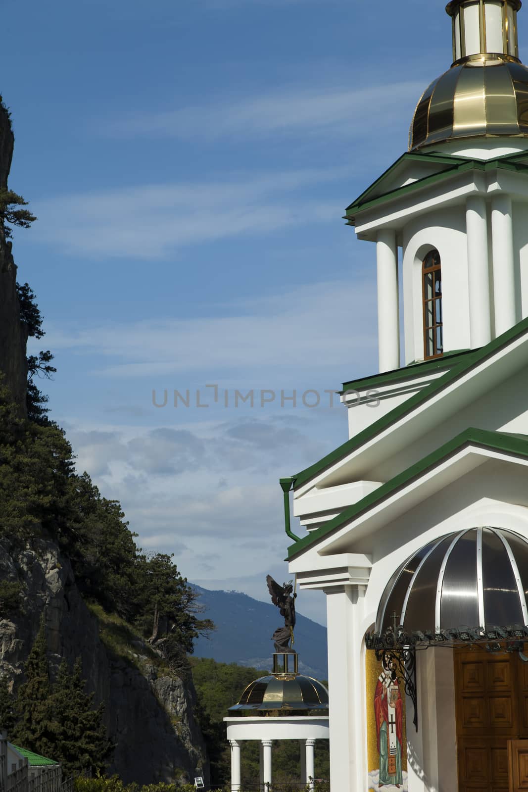 Orthodox church in beams of a bright sun against the blue sky