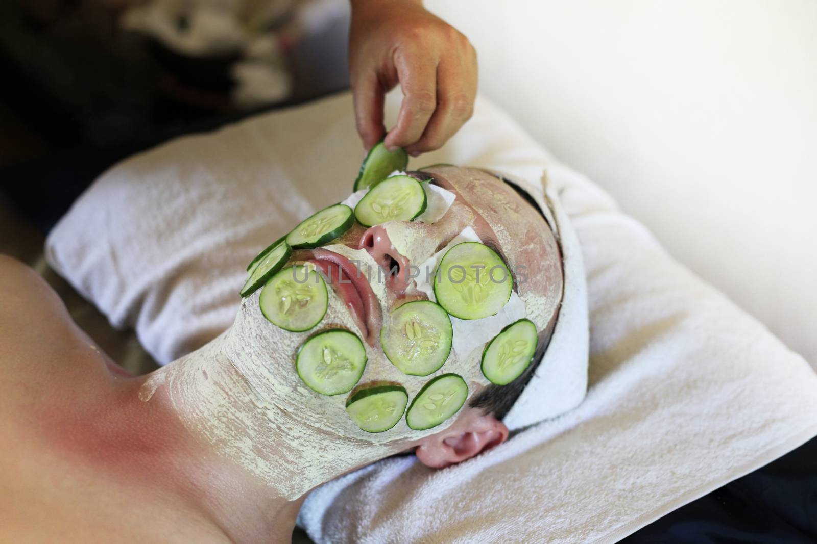 Mask from fresh cucumbers on face man