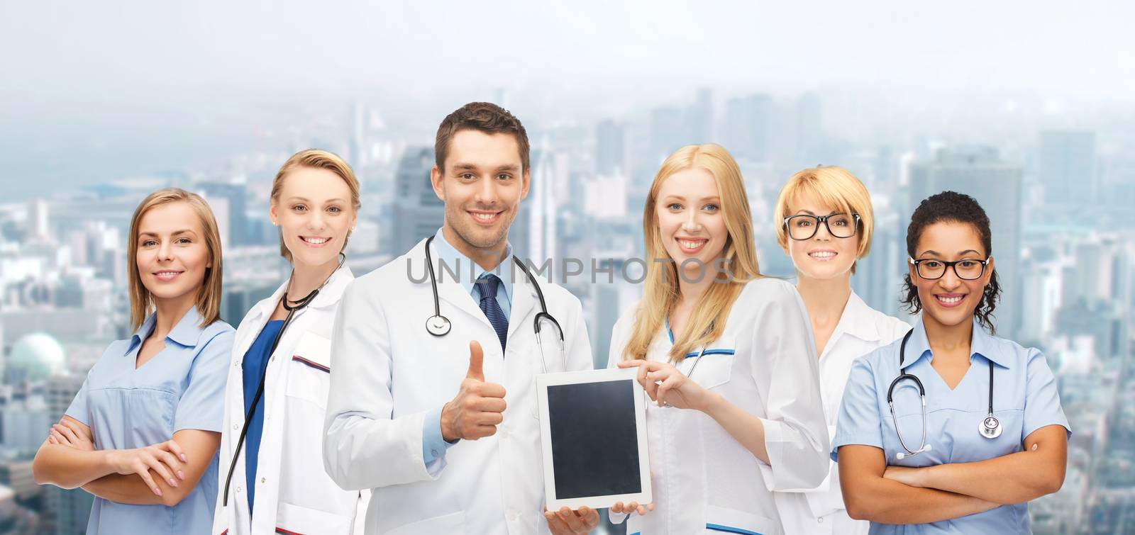 team or group of doctors with tablet pc computer by dolgachov