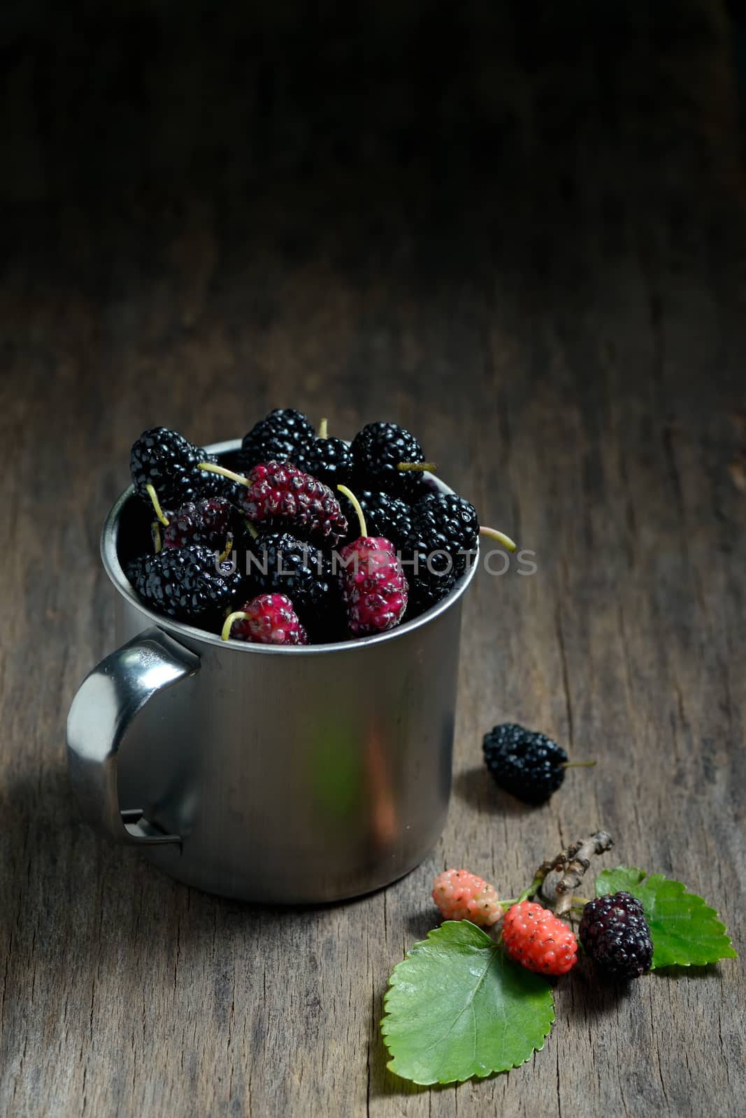 Mulberries fruit in an metal mug