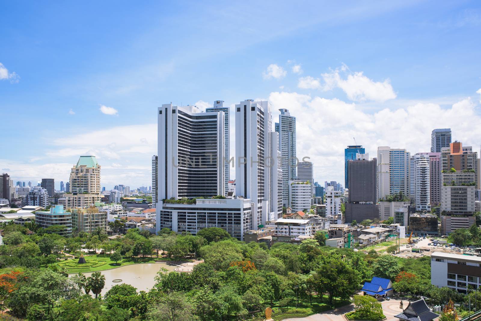 Bangkok Metropolis, the capital of Thailand. The Sukhumvit area with Benjasiri Park in the foreground.