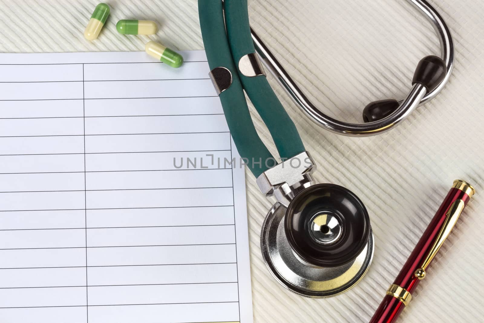 A doctors stethoscope and notepad - Space for Text