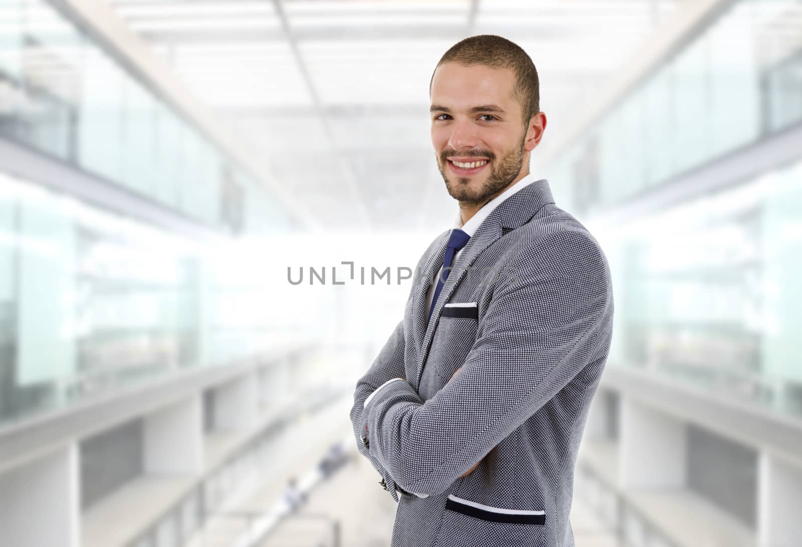 young happy businessman portrait at the office