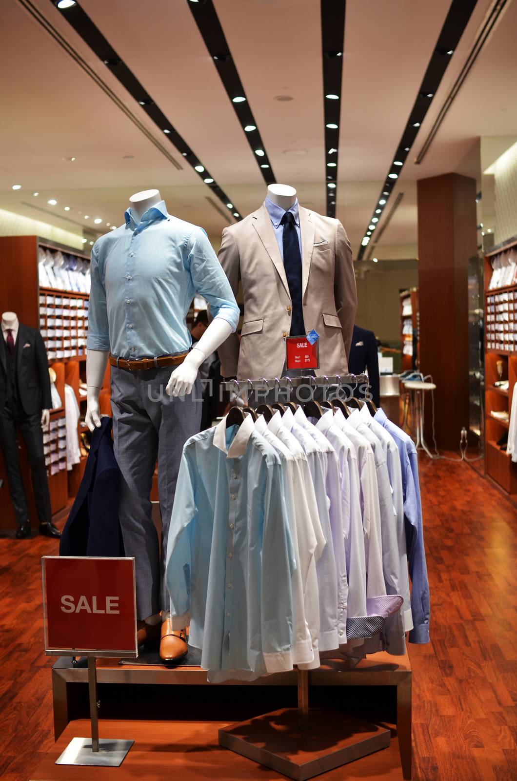 An office wear fashion store with two mannequin displaying the latest trend