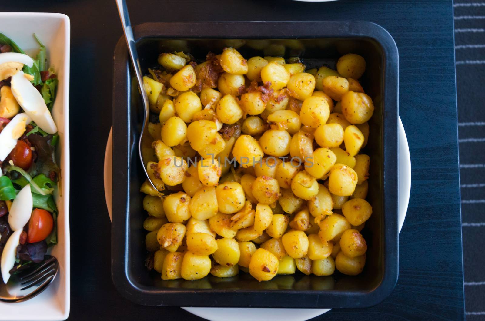 Roasted potatoes served on a plate