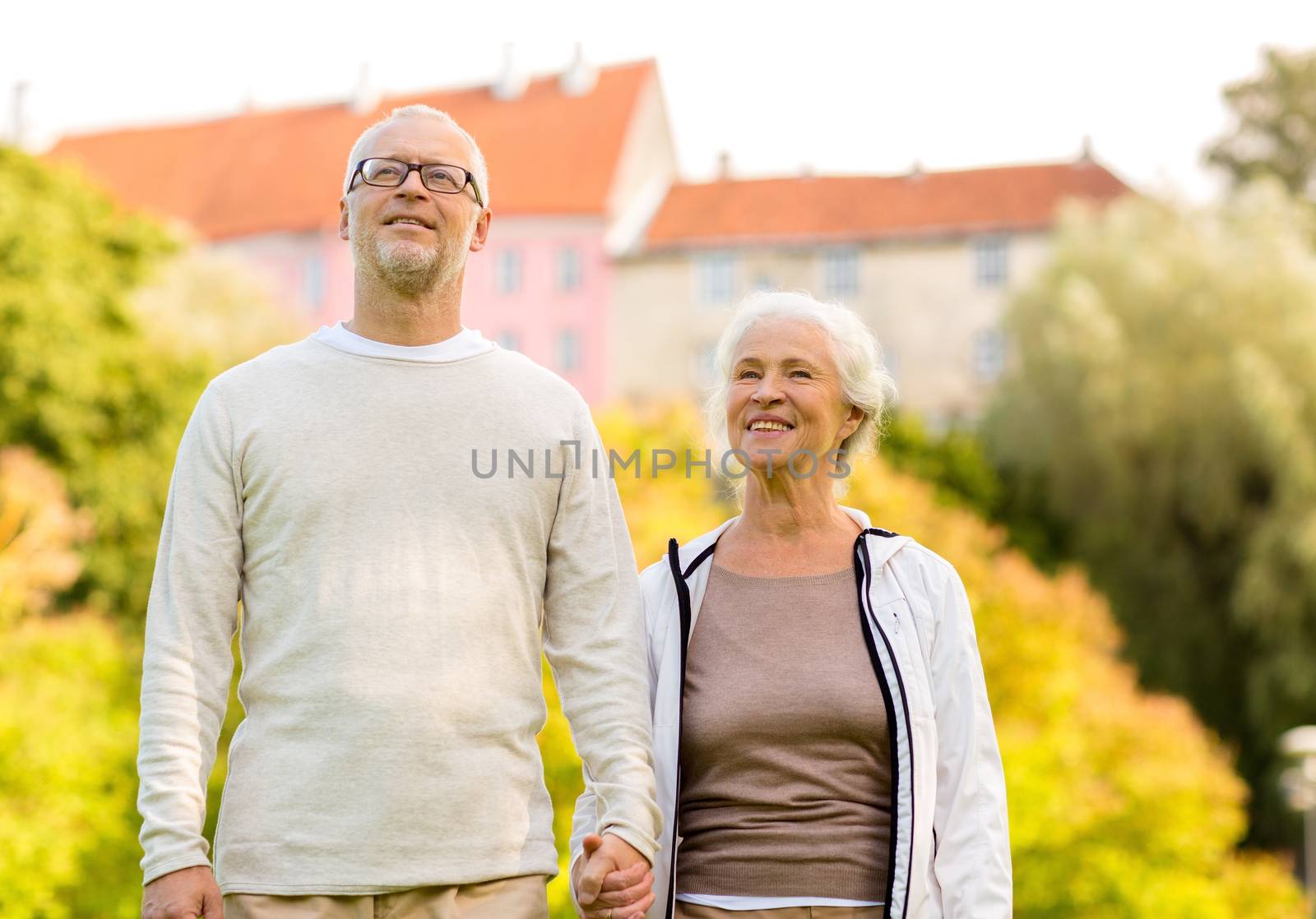 senior couple in city park by dolgachov