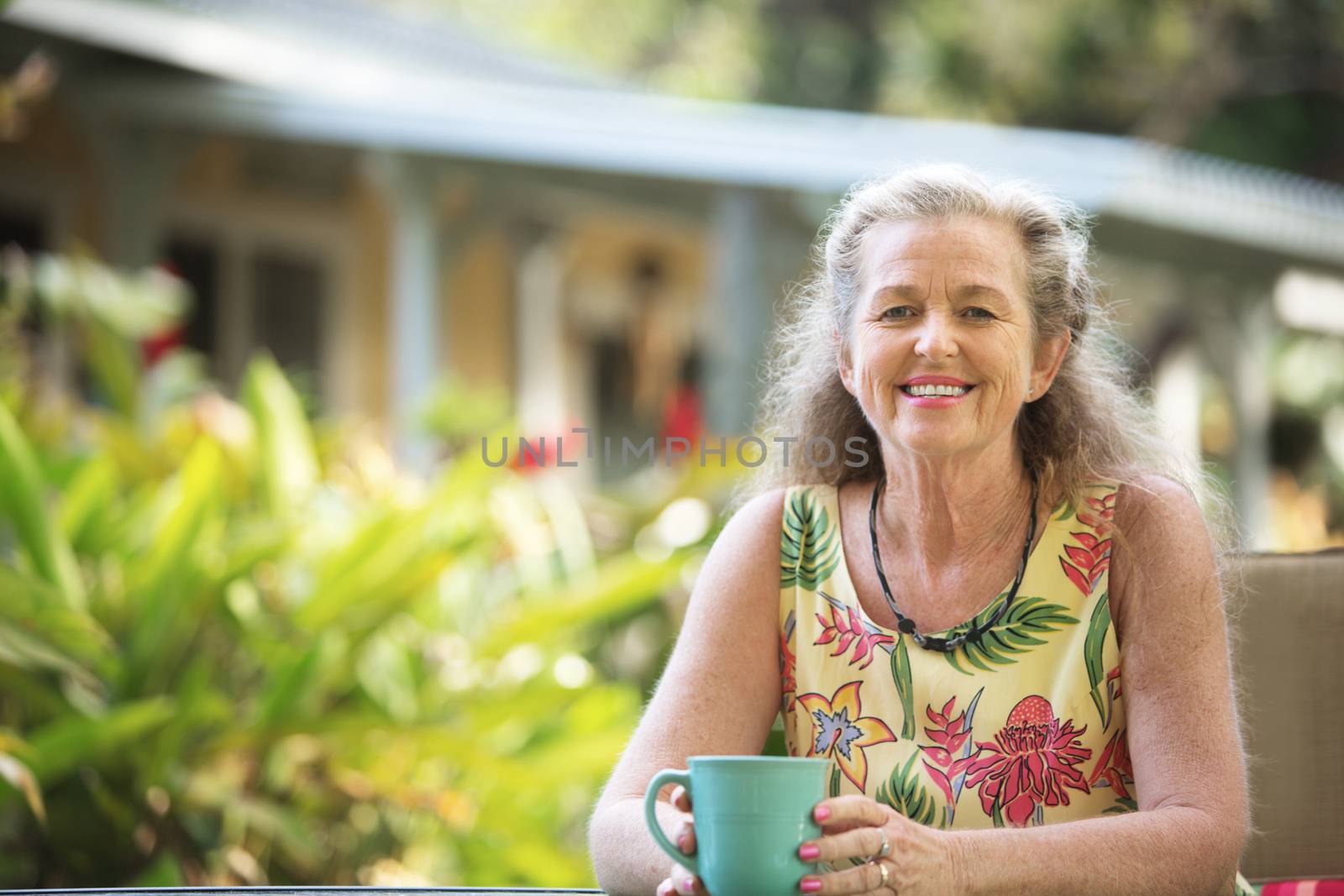 Single Caucasian adult female sitting outdoors in Maui