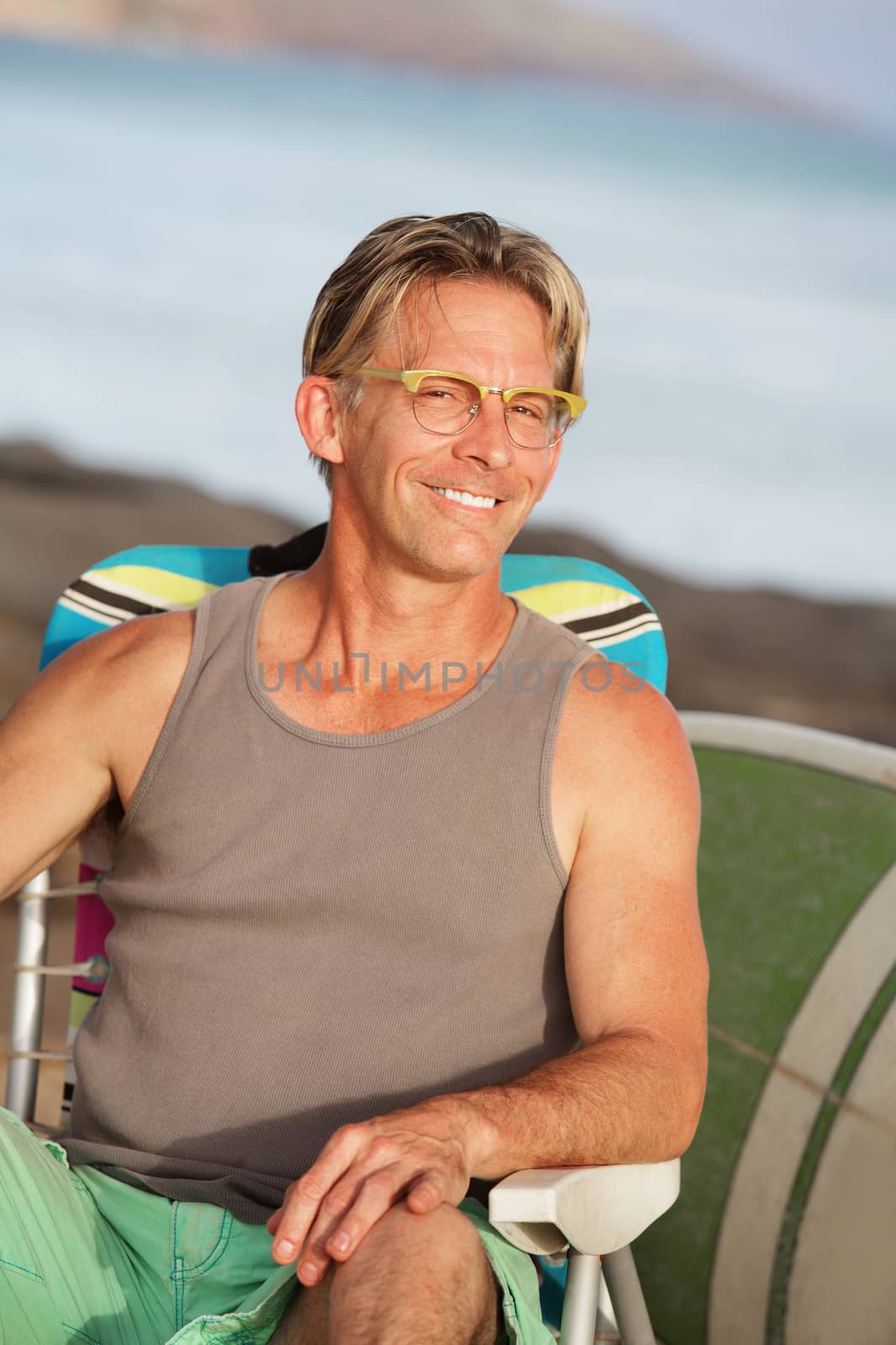 Close up of Smiling Man at Beach by Creatista