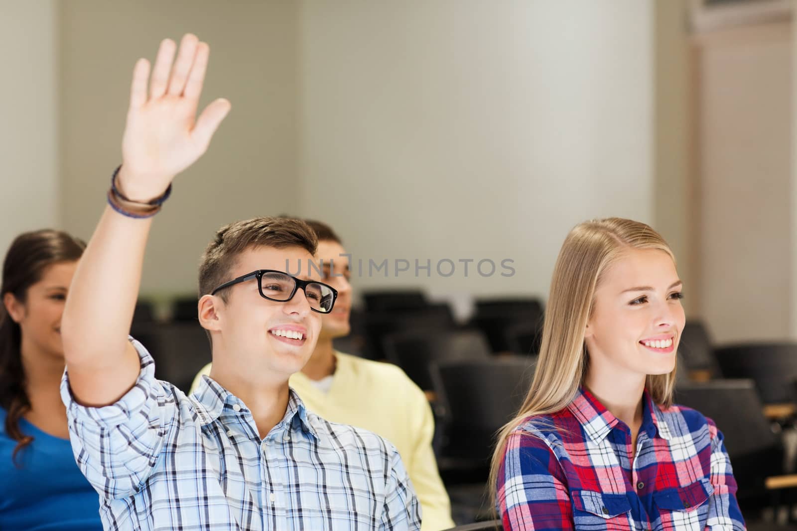 group of smiling students in lecture hall by dolgachov