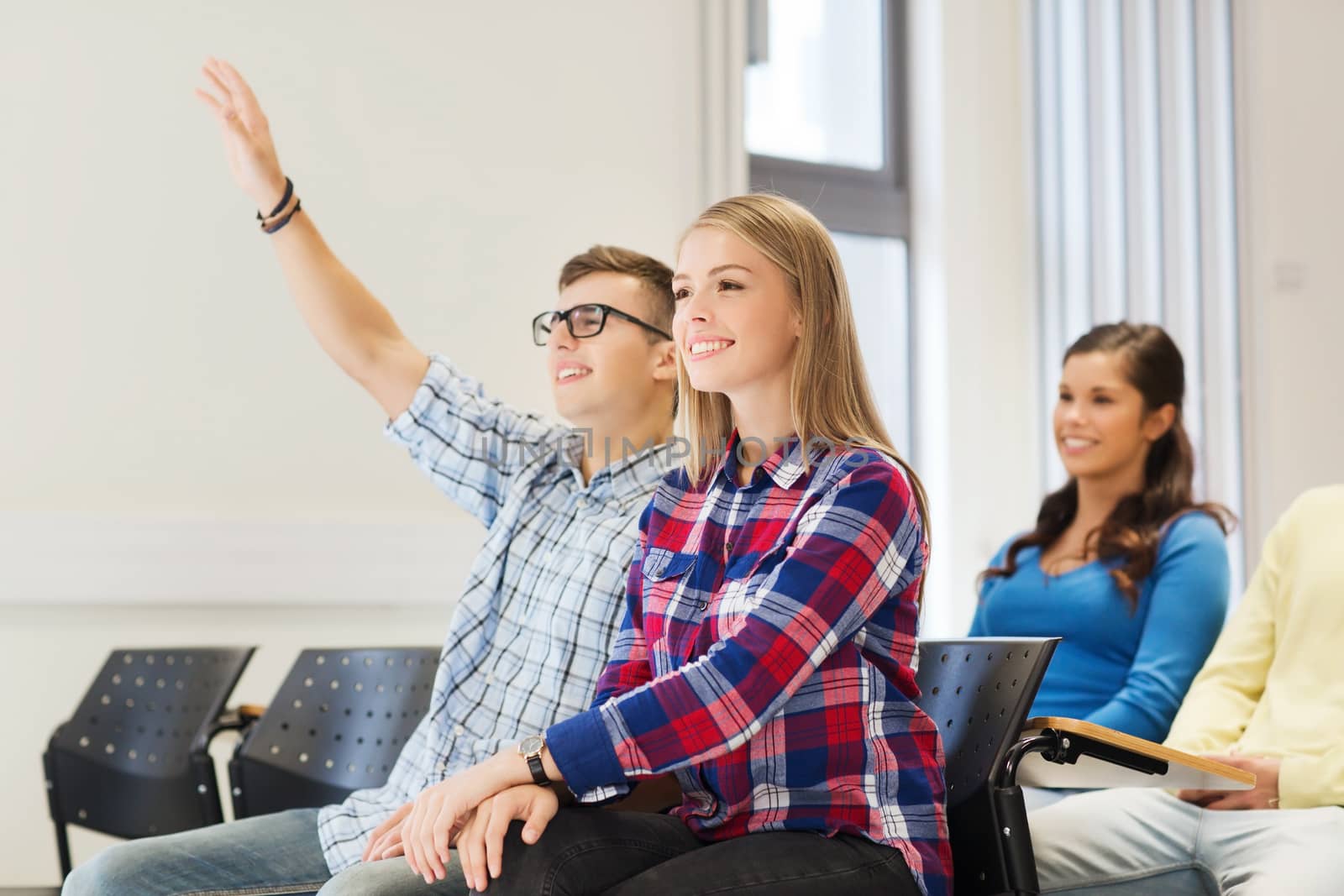 group of smiling students in lecture hall by dolgachov